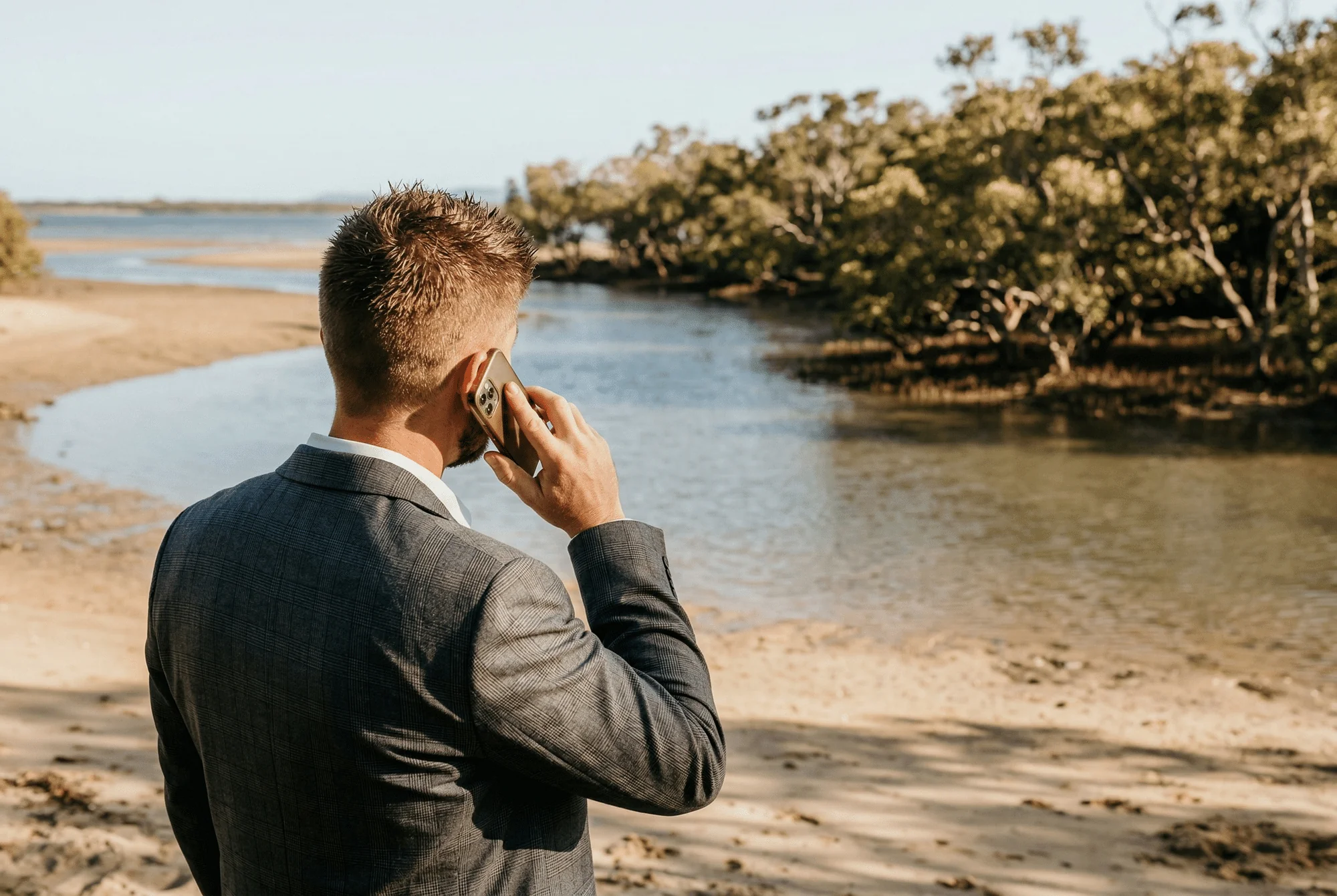 Sam Cook on a call at the Queensland foreshore